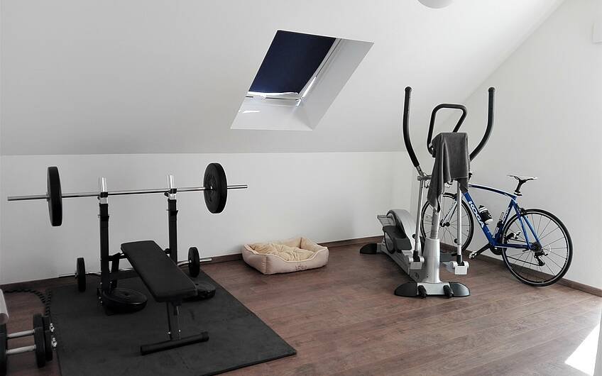 Fitnessraum im individuell geplanten Einfamilienhaus Signum von Kern-Haus in Einselthum