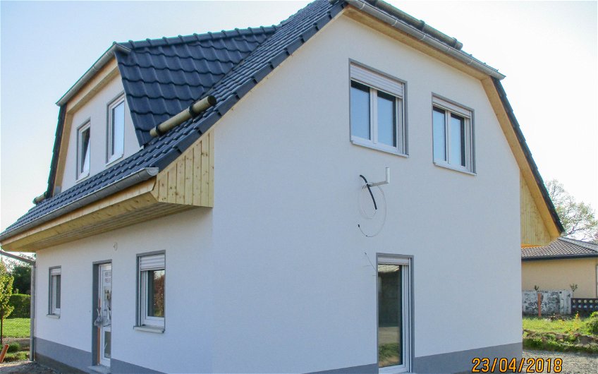 Fertigstellung Außenputz auf Kern-Haus in Grimma