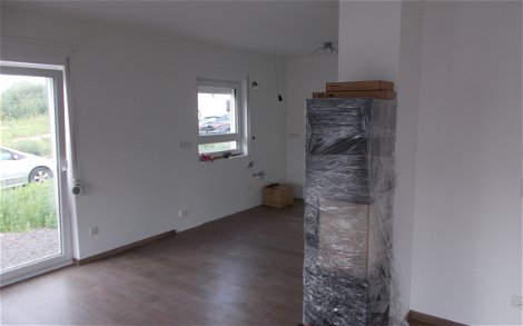 Kaminofen im Wohn- und Esszimmer des individuell geplanten Einfamilienhauses Signum von Kern-Haus in Einselthum