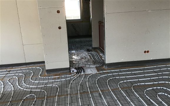 Fußbodenheizung in der individuell geplanten Doppelhaushälte Twin XXL von Kern-Haus in Korb